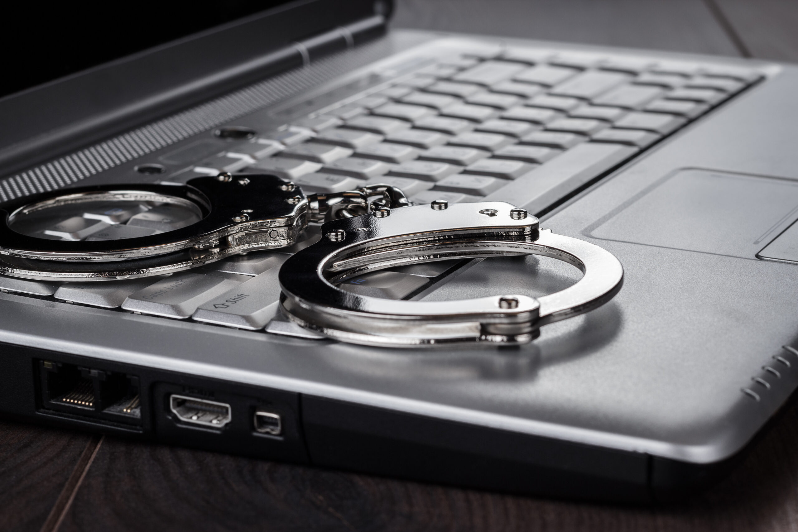 Handcuffs on a Laptop